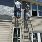 Workers make windows for home